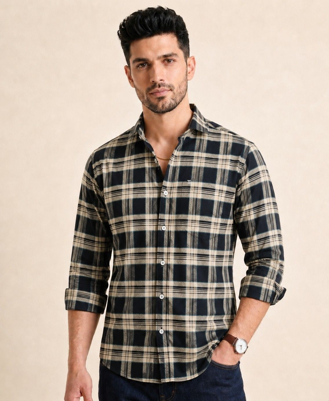 Man wearing a plaid shirt on a beige background